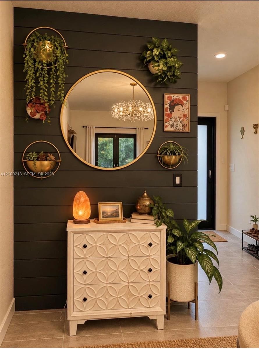 Dark-toned horizontal shiplap accent wall featuring a recessed light fixture and large-format tile flooring