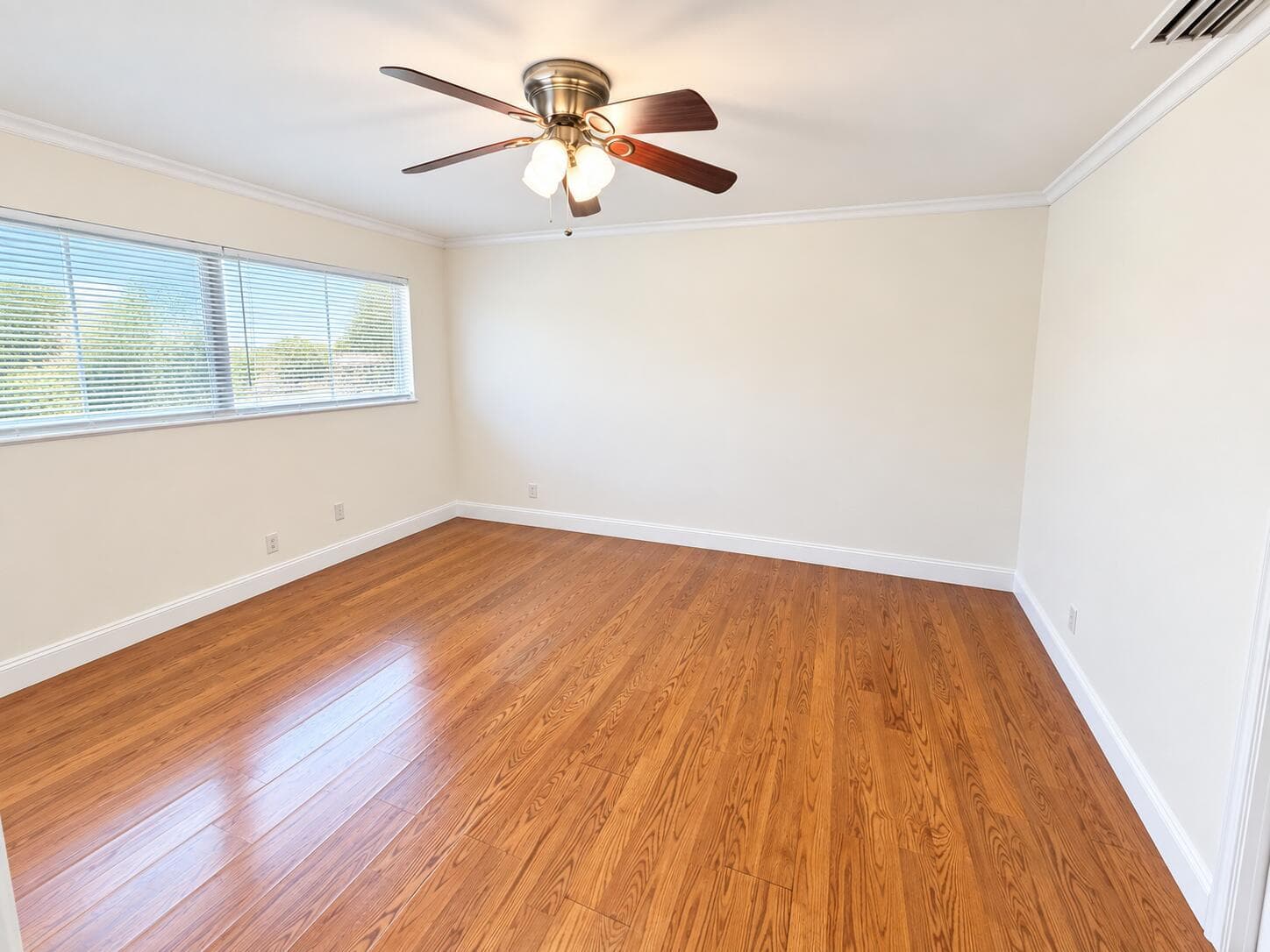 Bright Bedroom with Hardwood Floors