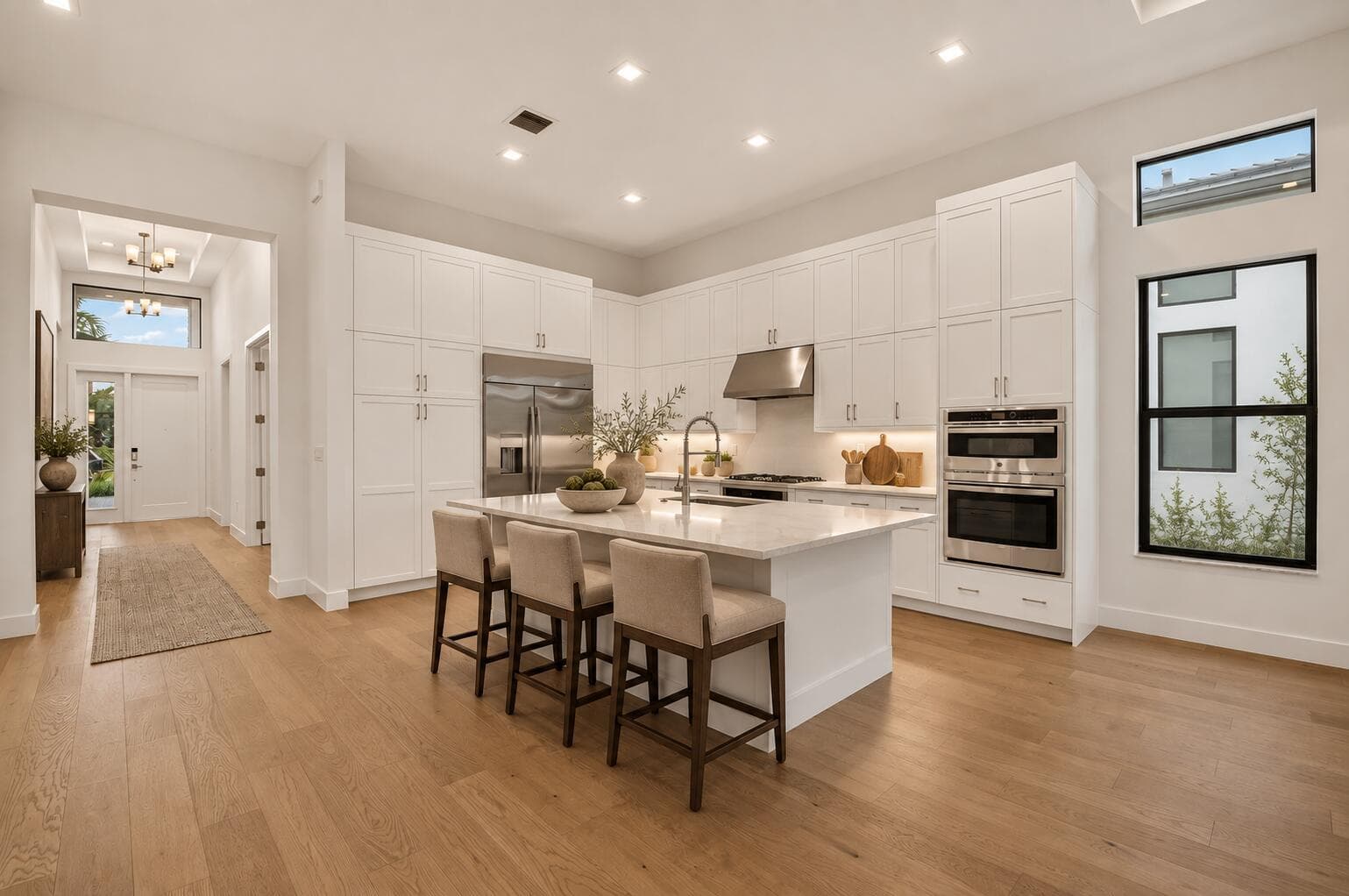 Warm taupe kitchen with dark oak stools-