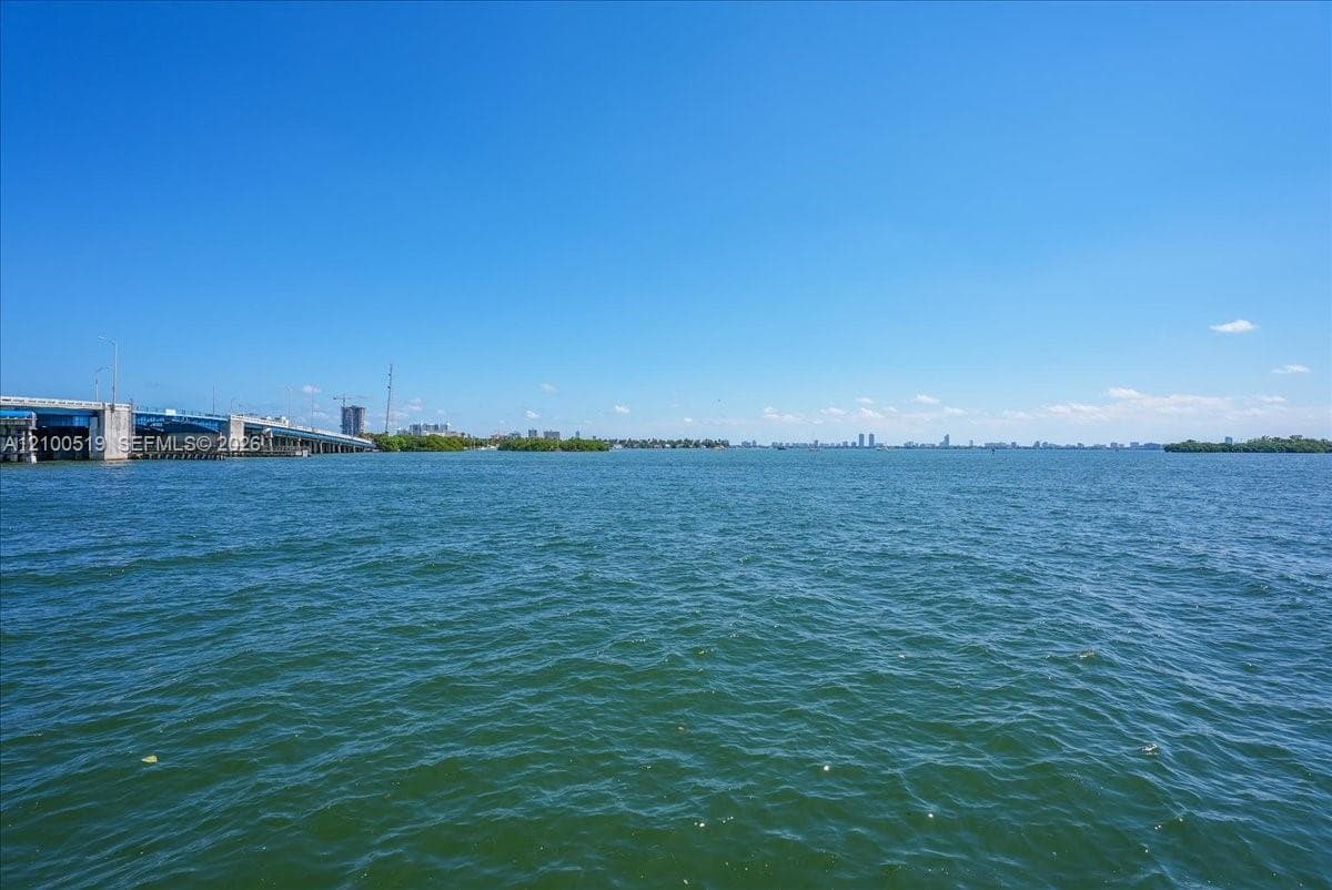 Extensive open-water frontage featuring coastal scenery and a distant skyline