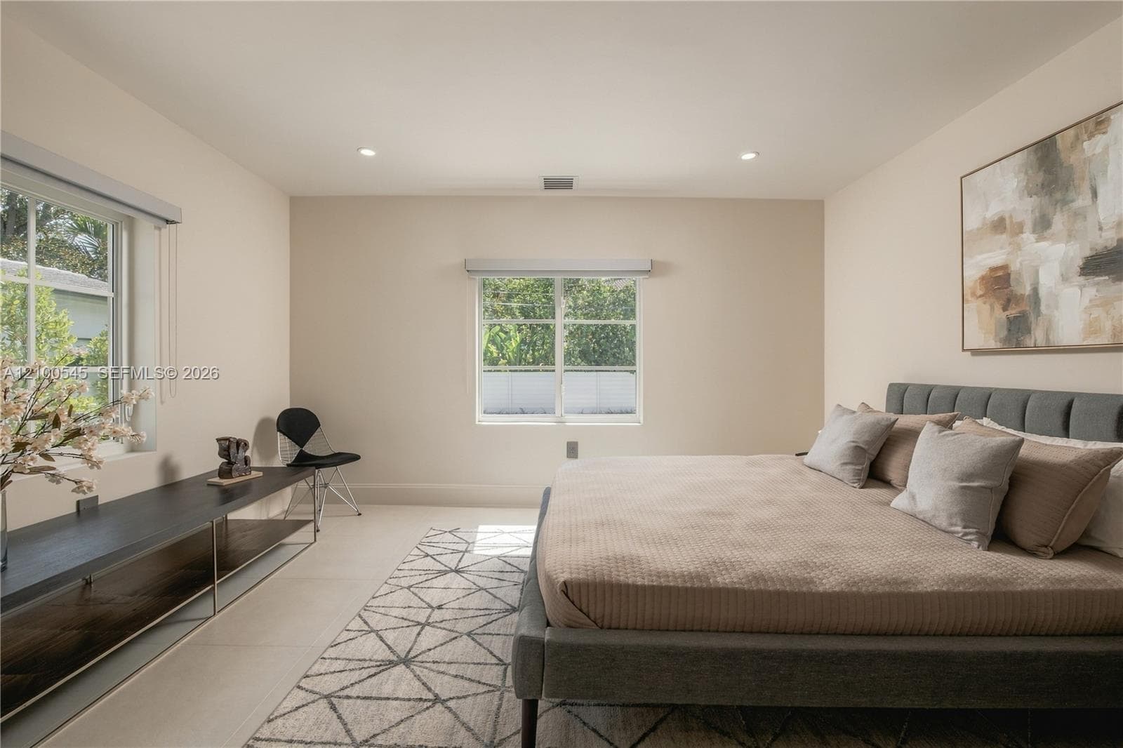 Spacious Bedroom 2 with pool view.
