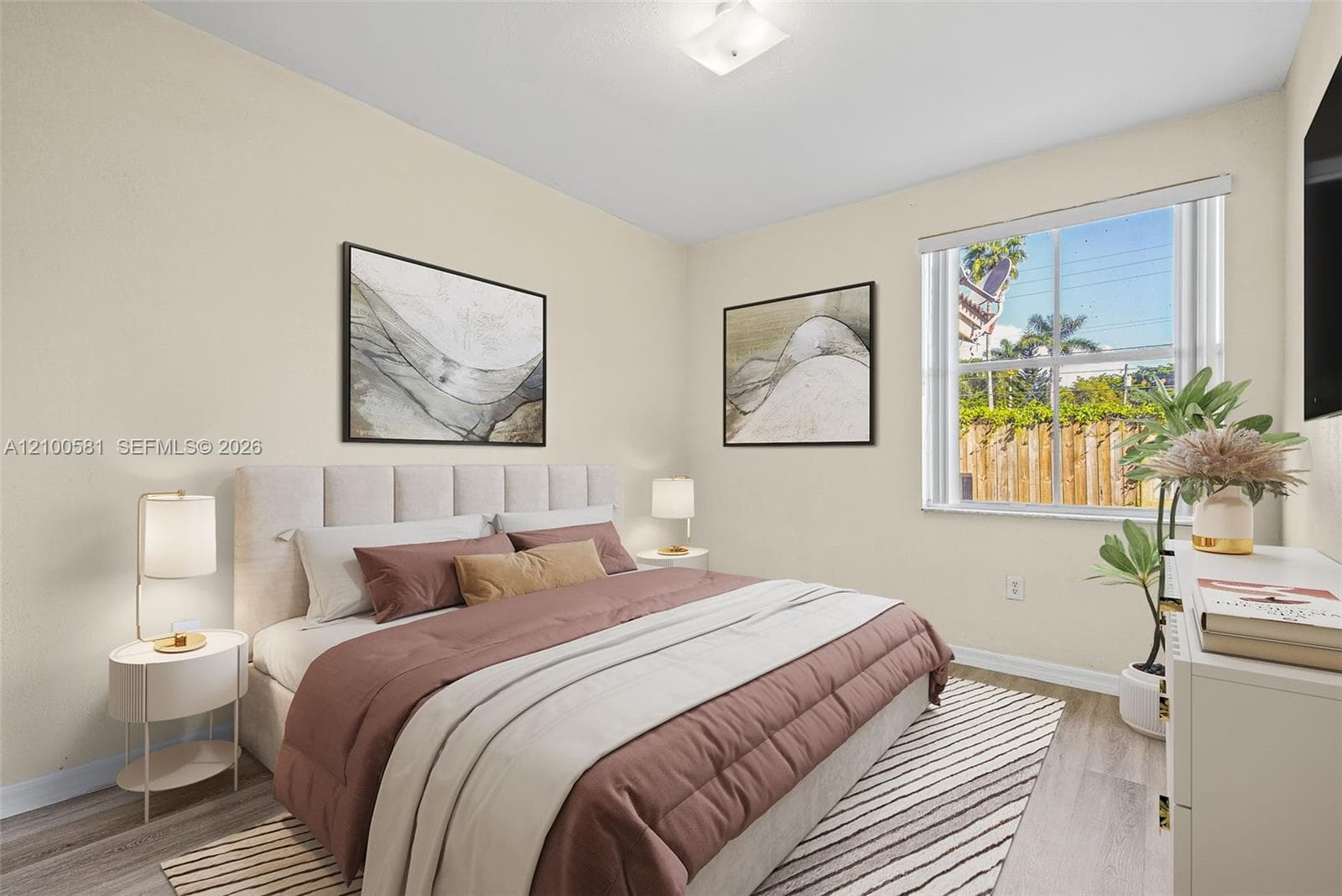 Room featuring a four-panel bi-fold closet, a classic six-panel interior door, and neutral-toned wall paint