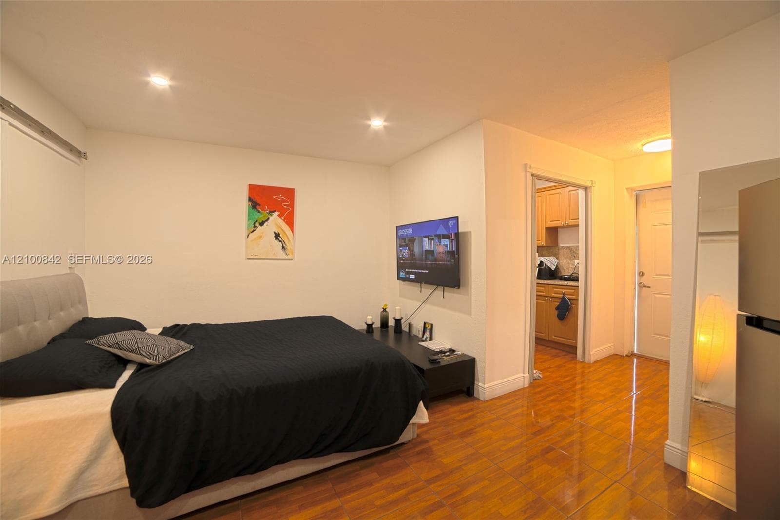Room featuring wood-finish flooring and recessed lighting