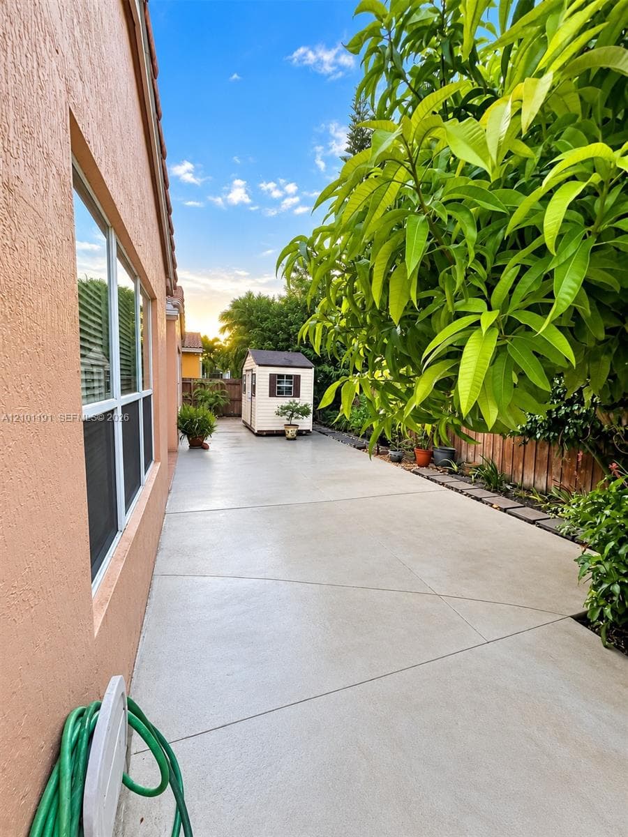 Wraparound Concrete Patio & Low-Maintenance Yard