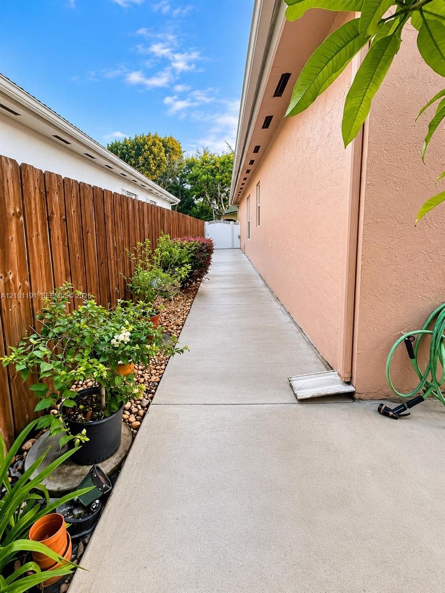 Wraparound Concrete Patio & Low-Maintenance Yard