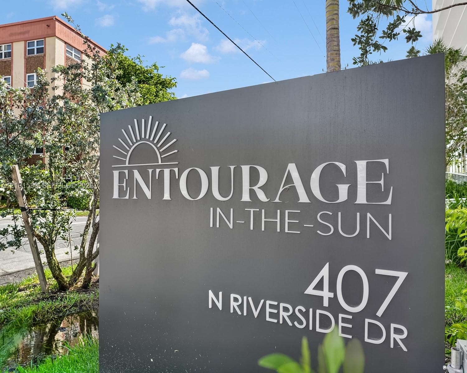 Ground-mounted signage featuring dimensional lettering on a charcoal-finished monument sign
