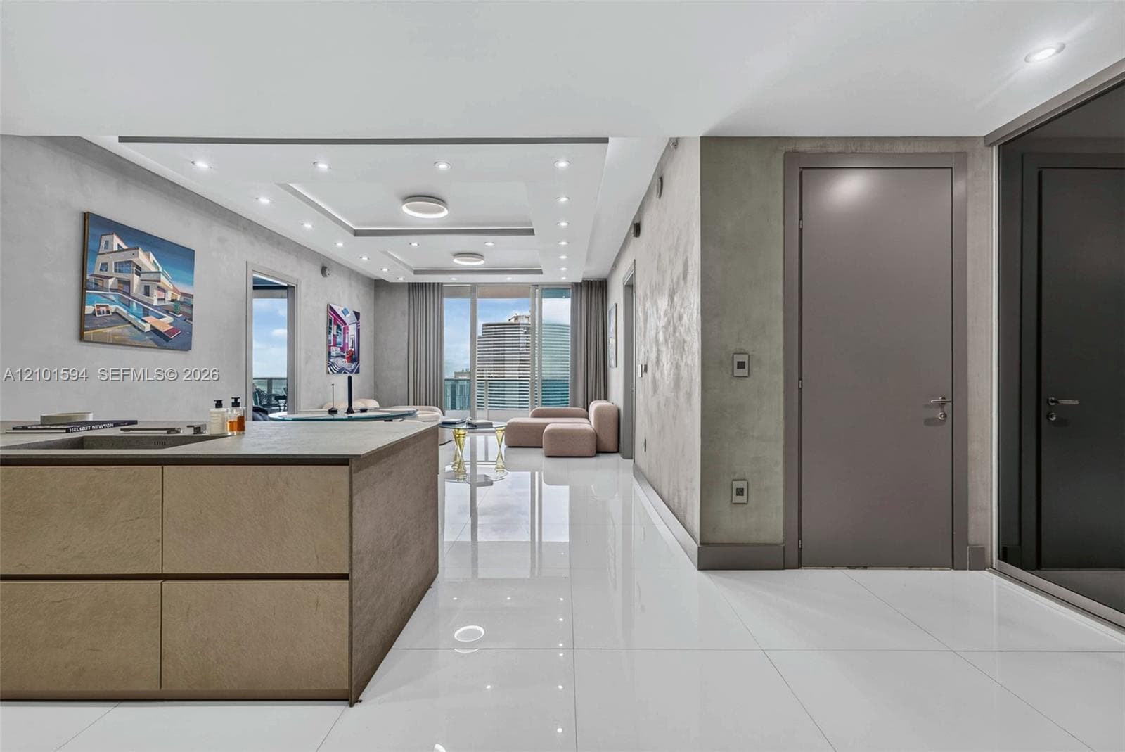 Kitchen and living area with clean contemporary finishes and open sightlines.