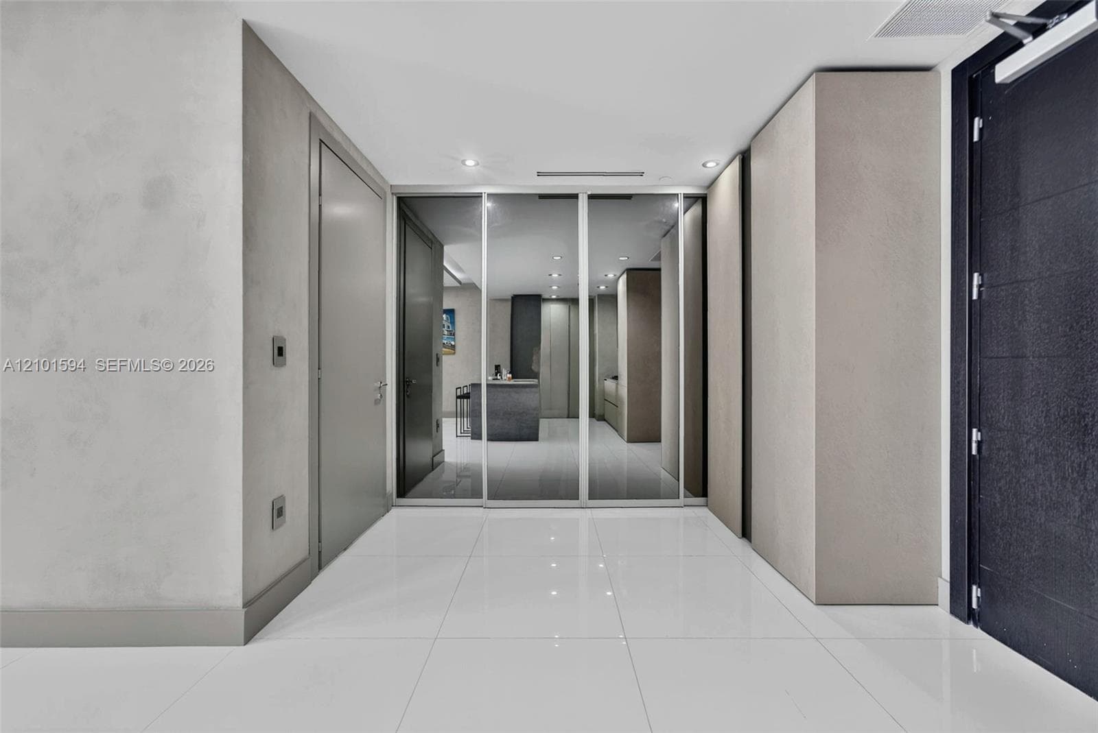 Entry and interior hall with sleek built-in storage.