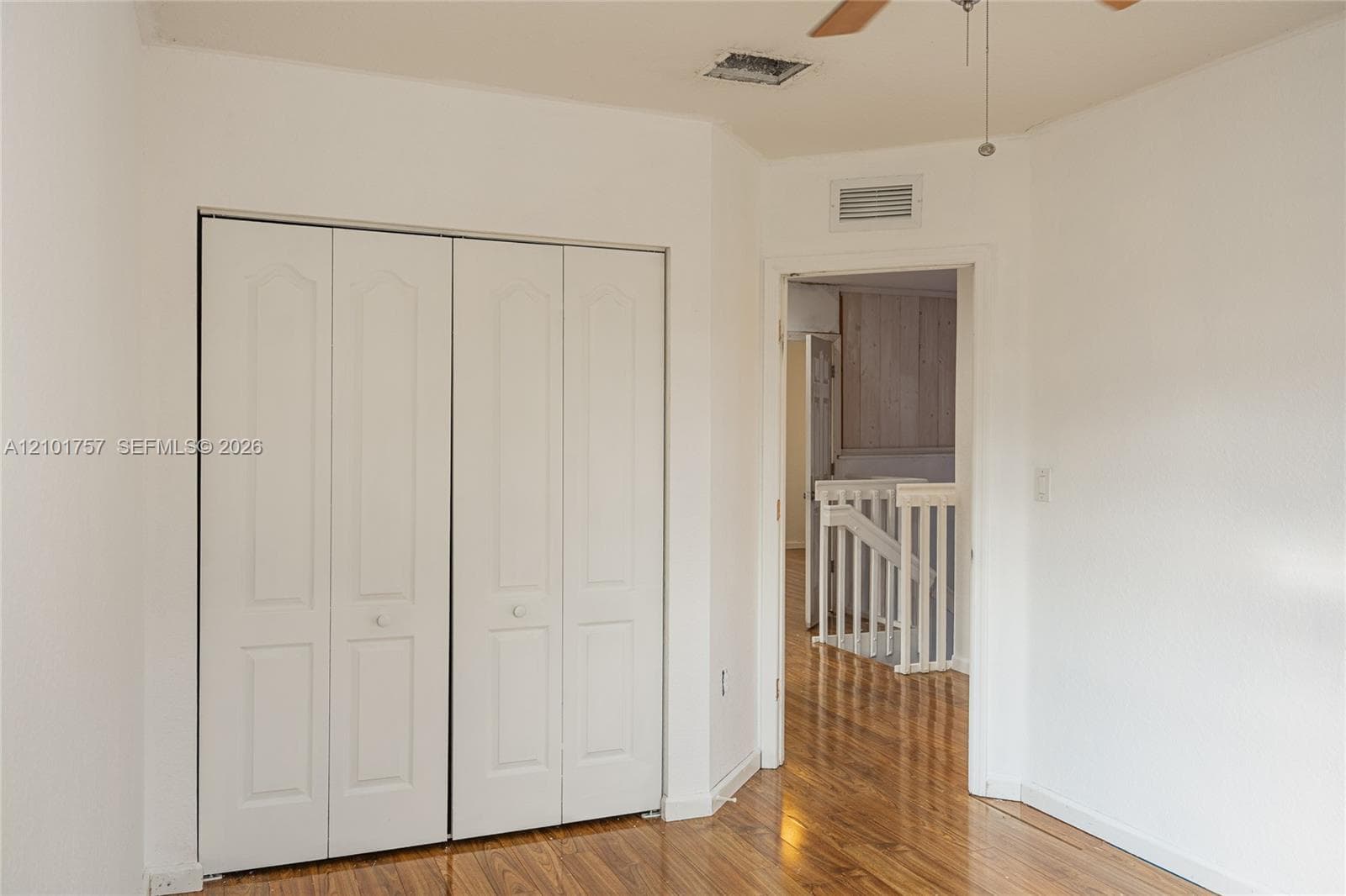 Wood-finish flooring with white walls