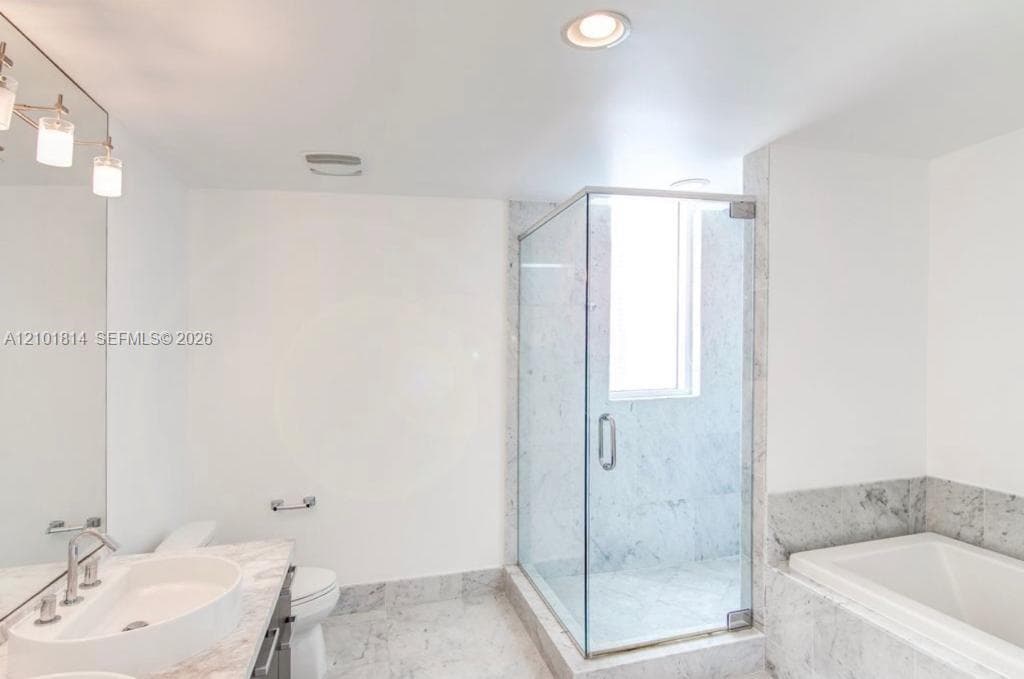 Master bathroom with shower and tub