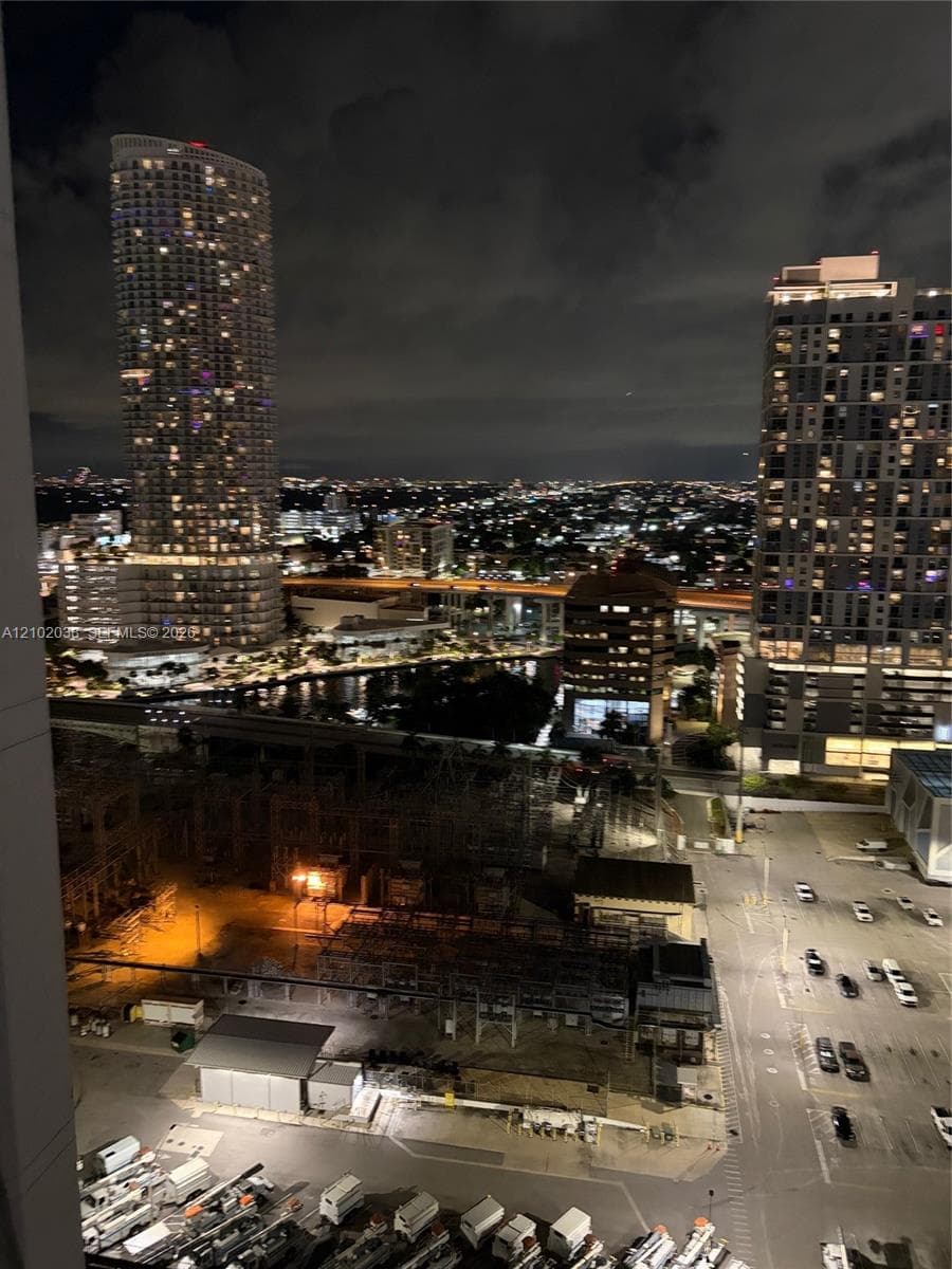 High-rise perspective featuring expansive urban cityscapes and surrounding skyscraper silhouettes