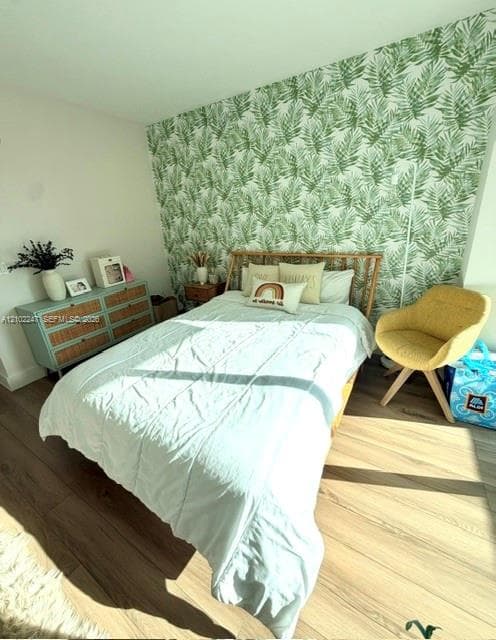 Room featuring wood-finish flooring