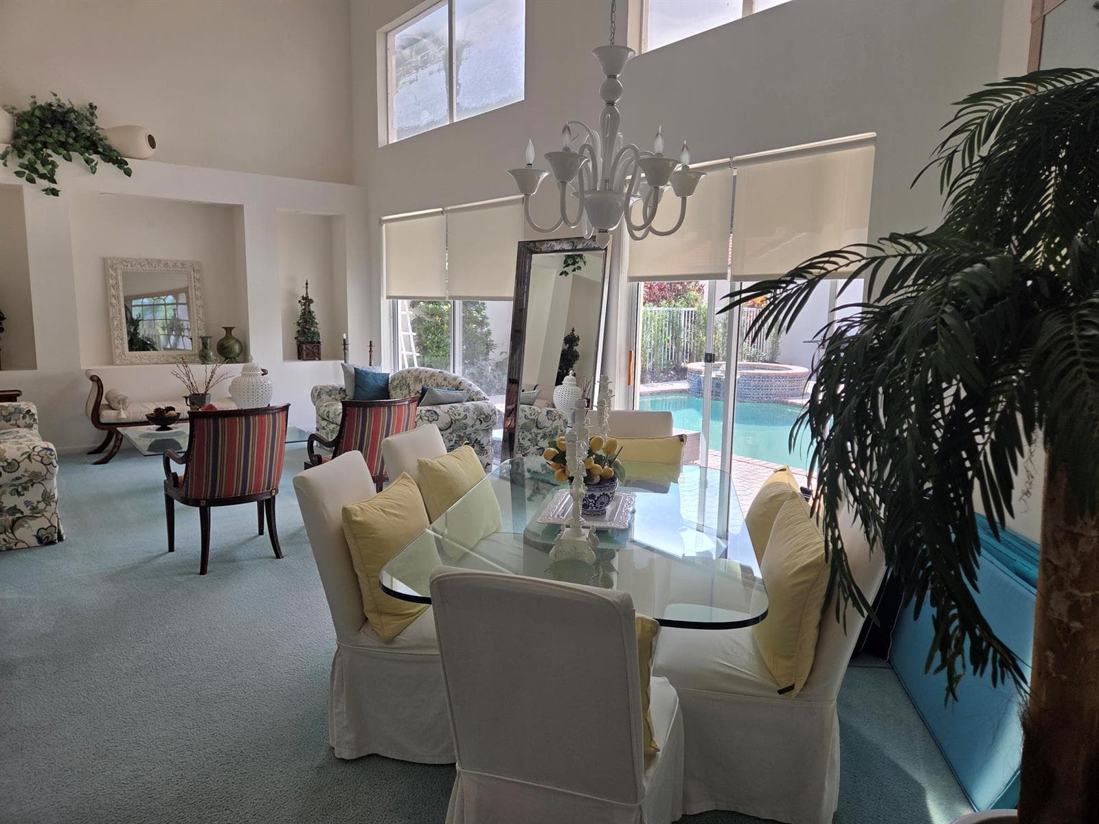 Living room and dining room with pool vi