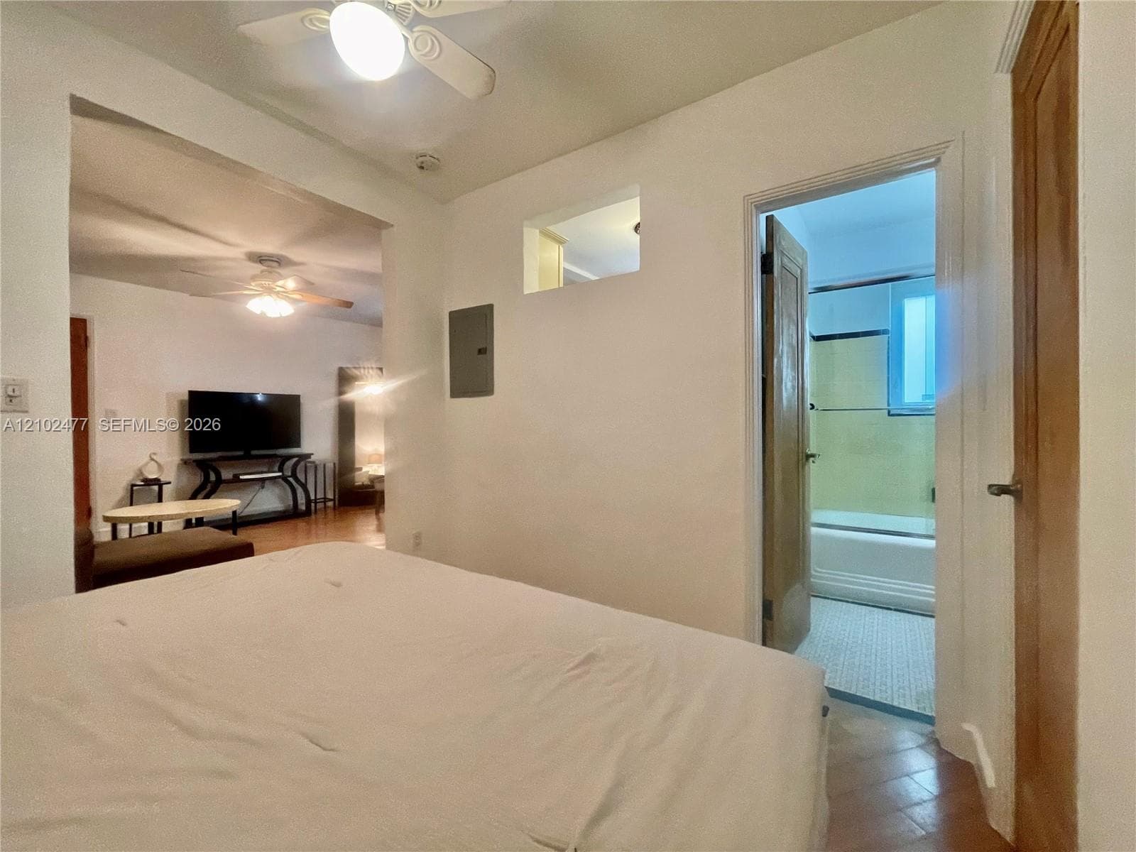 Interior space featuring ceiling fans, recessed wall niches, and wood-finish interior doors