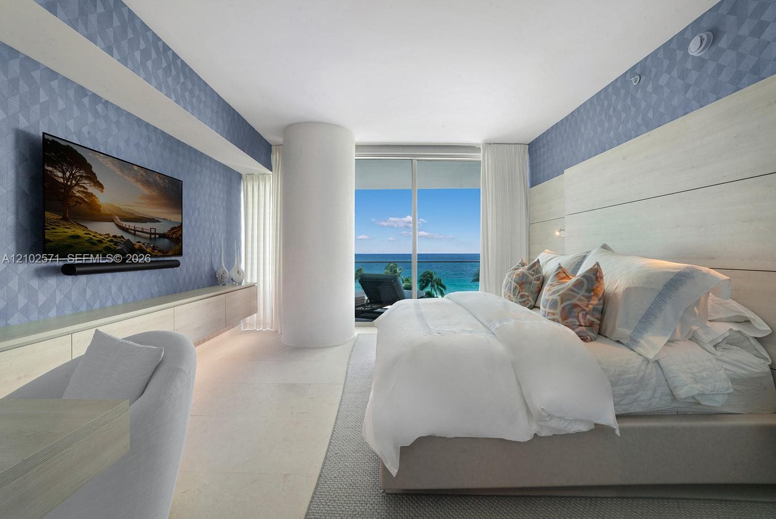 Floor-to-ceiling sliding glass doors, built-in light-tone cabinetry, geometric patterned wall covering, horizontal wood-panel wall feature, and natural stone flooring