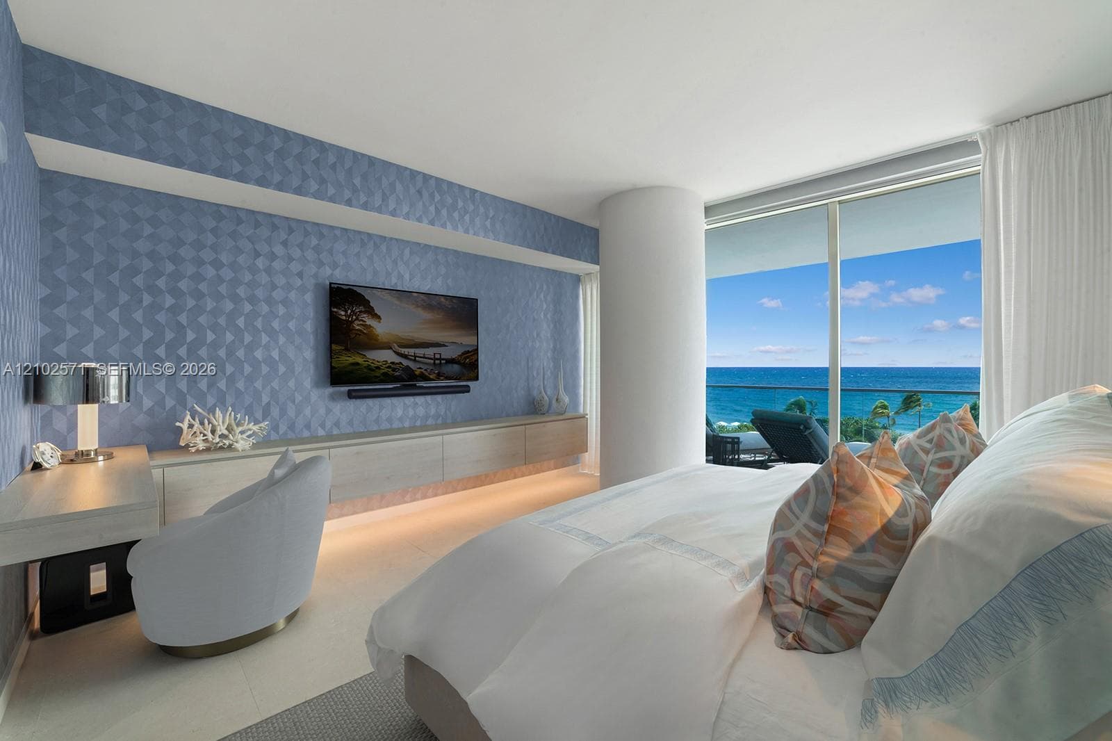 Floor-to-ceiling windows, textured accent wall, built-in cabinetry, and tile flooring