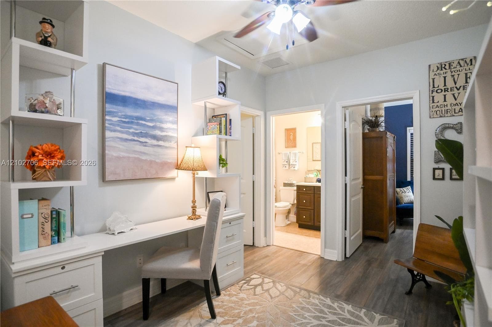 wood-finish flooring, and ceiling fan with integrated lighting
