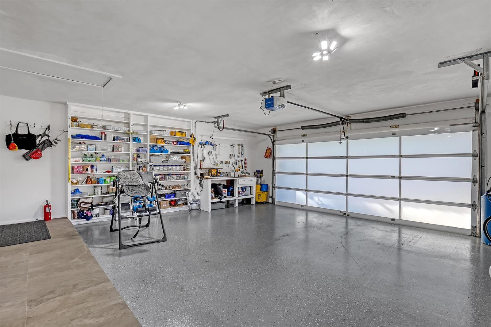 Garage with epoxy floor and glass door