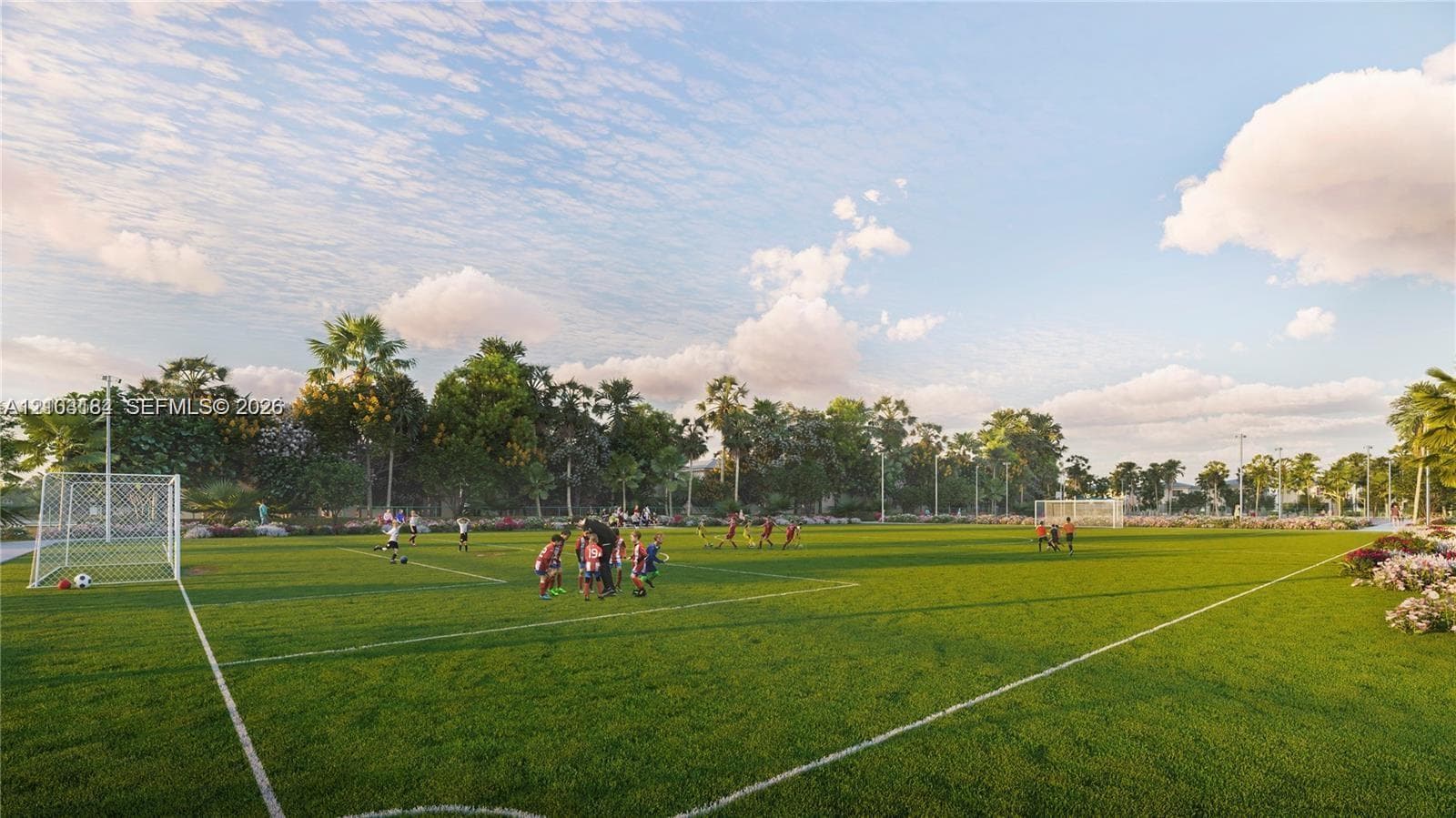 Full-sized synthetic turf soccer field featuring integrated goal posts, painted boundary lines, and perimeter landscaping
