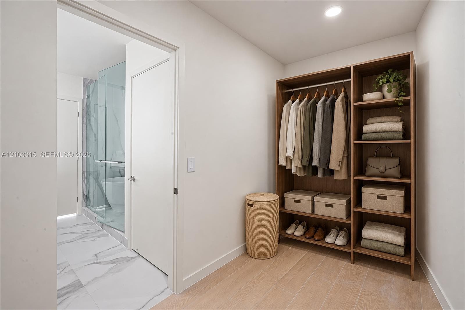 Custom built-in closet system with open shelving and hanging rods