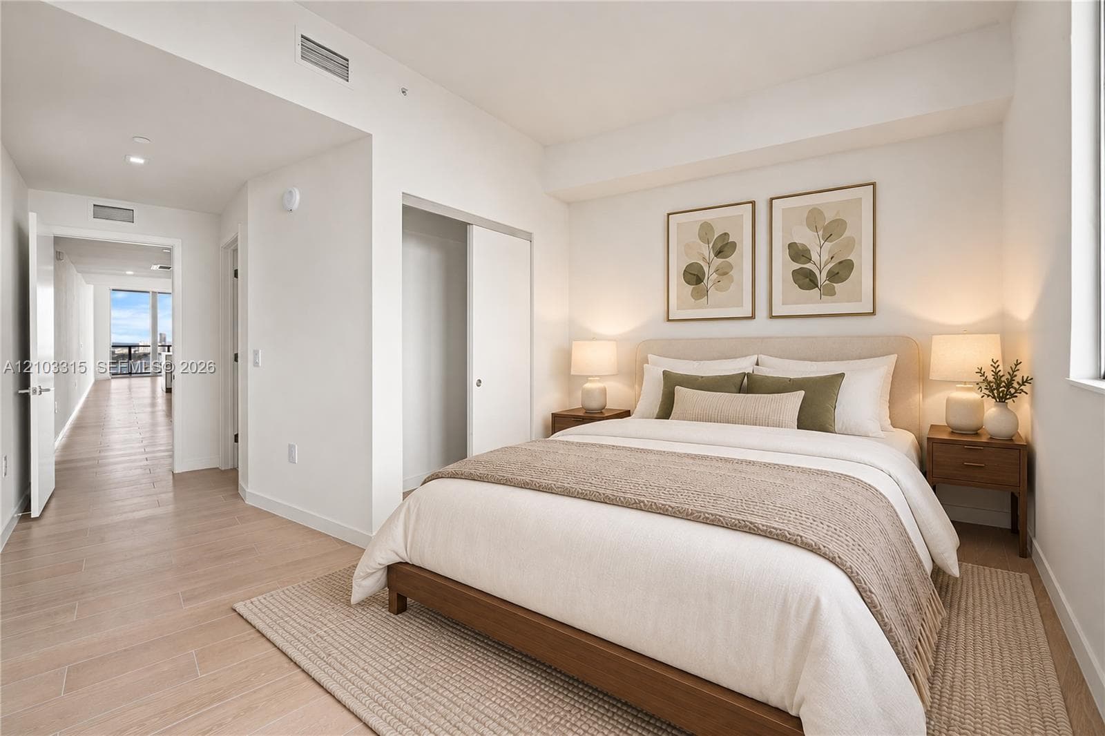 Recessed lighting, wood-finish flooring, sliding closet doors, and light-toned walls