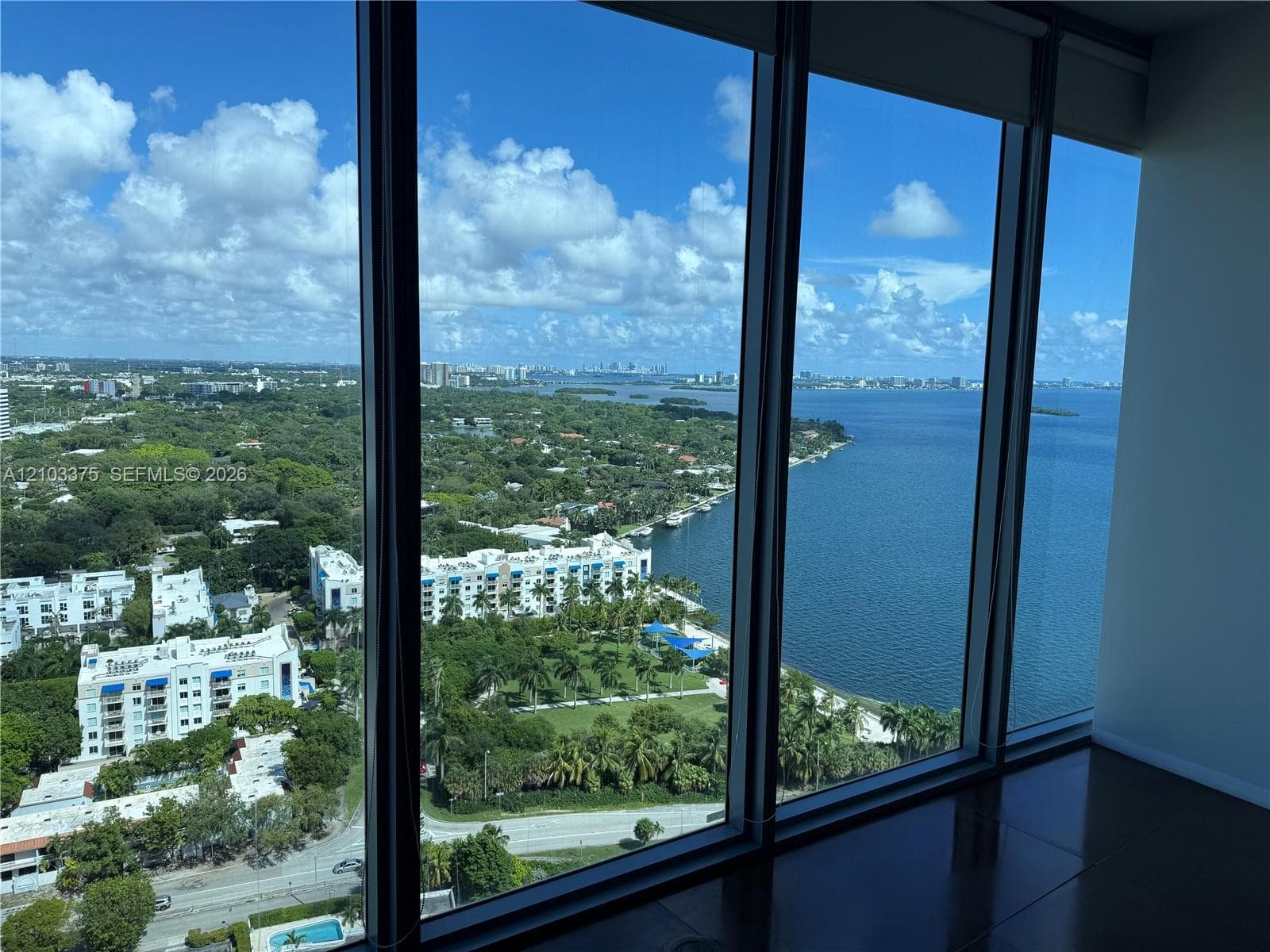 Floor-to-ceiling windows featuring panoramic water and coastal landscape exposures