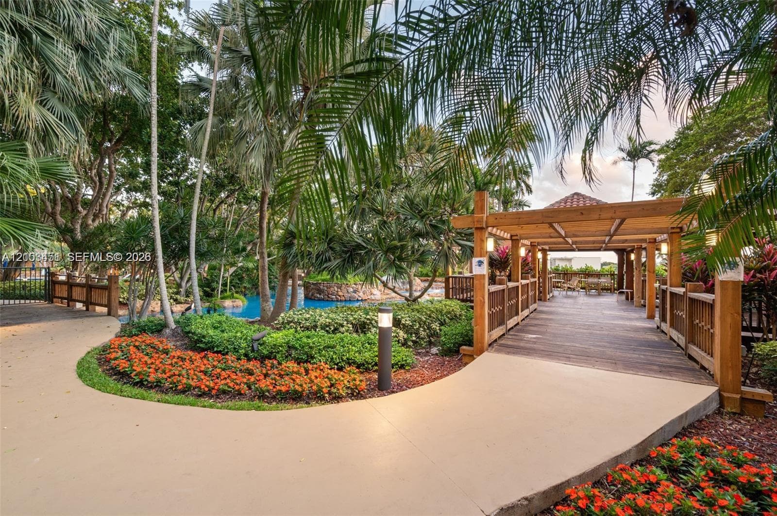 Experience the luxurious third-floor deck, complete with a heated pool, inviting hot tub, and a barbecue area perfect for entertaining guests. Immerse yourself in the beautifully landscaped surroundings and take in the soothing sounds of tranquil waterfalls.