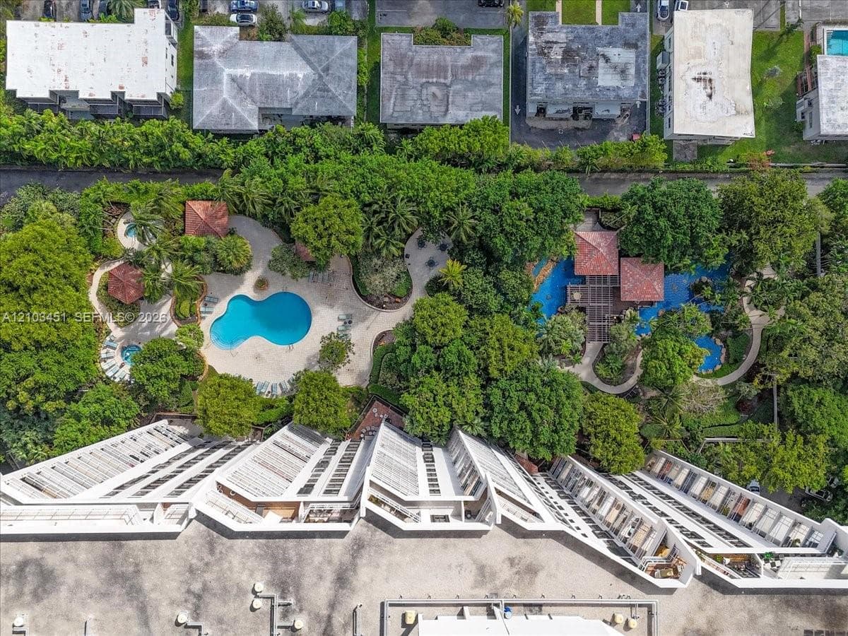 Experience the breathtaking south side aerial view! Marvel at the stunning waterfalls on the left, while the inviting barbecue area awaits on the right. Don't miss out on the expansive third-floor pool area—perfect for relaxation and recreation!