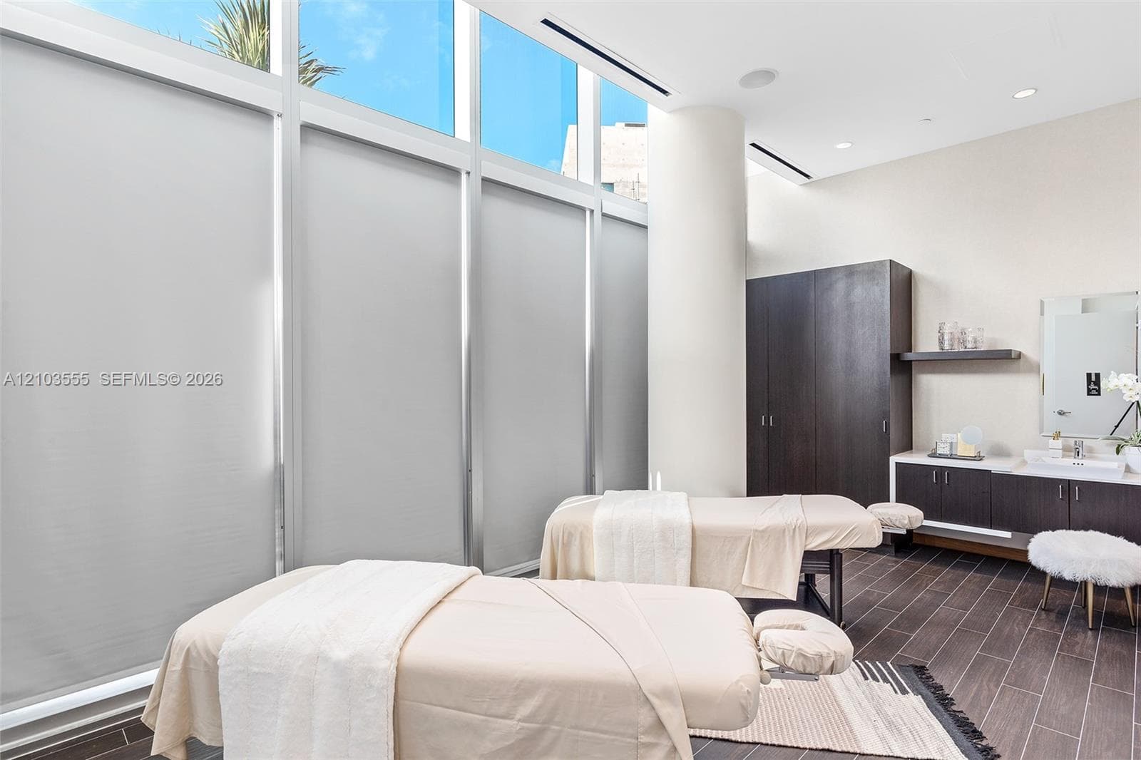 Floor-to-ceiling windows with roller shades