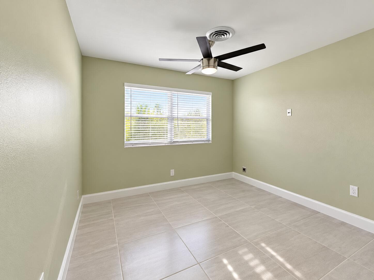 Minimal Sage Bedroom with Fan and Window