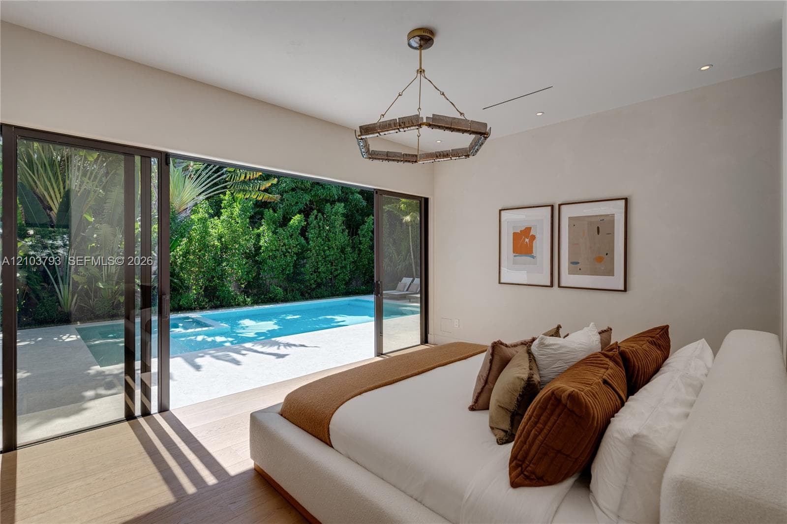 Interior space featuring neutral wall tones, recessed lighting, and a large rectangular window with dark frame finishes
