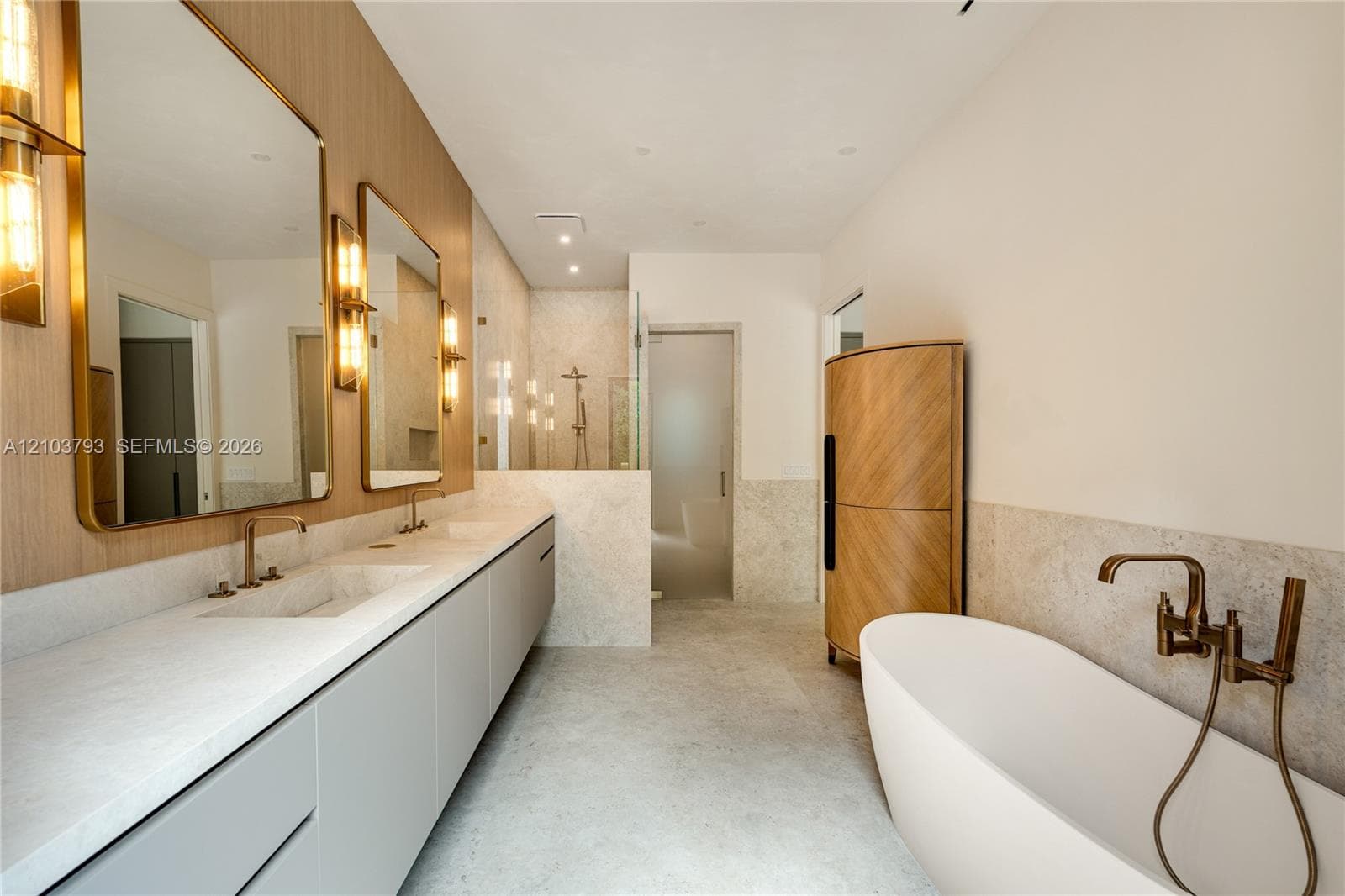 Wood-finish flooring, recessed lighting, neutral wall palette, and multiple windows with exterior greenery