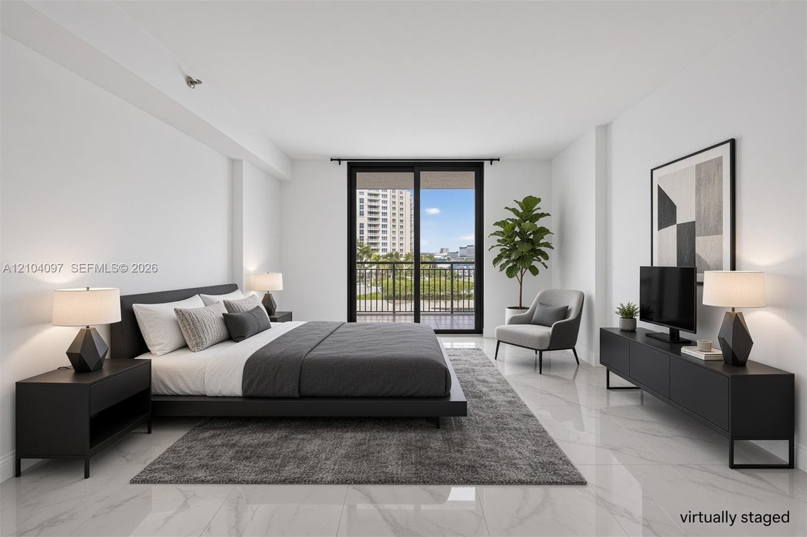 Spacious room featuring polished stone-finish flooring and large sliding glass doors opening to a balcony with metal railing