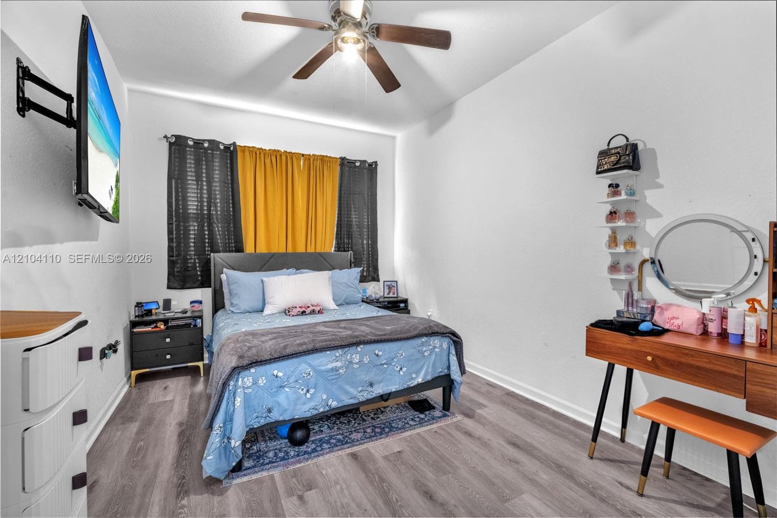 Recessed lighting and ceiling fan, wood-finish flooring, and white painted walls