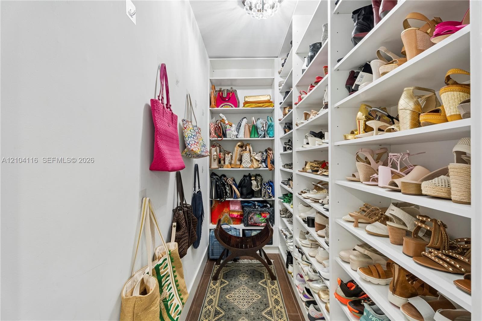 Dedicated shoe and handback walk-in closet in Primary
