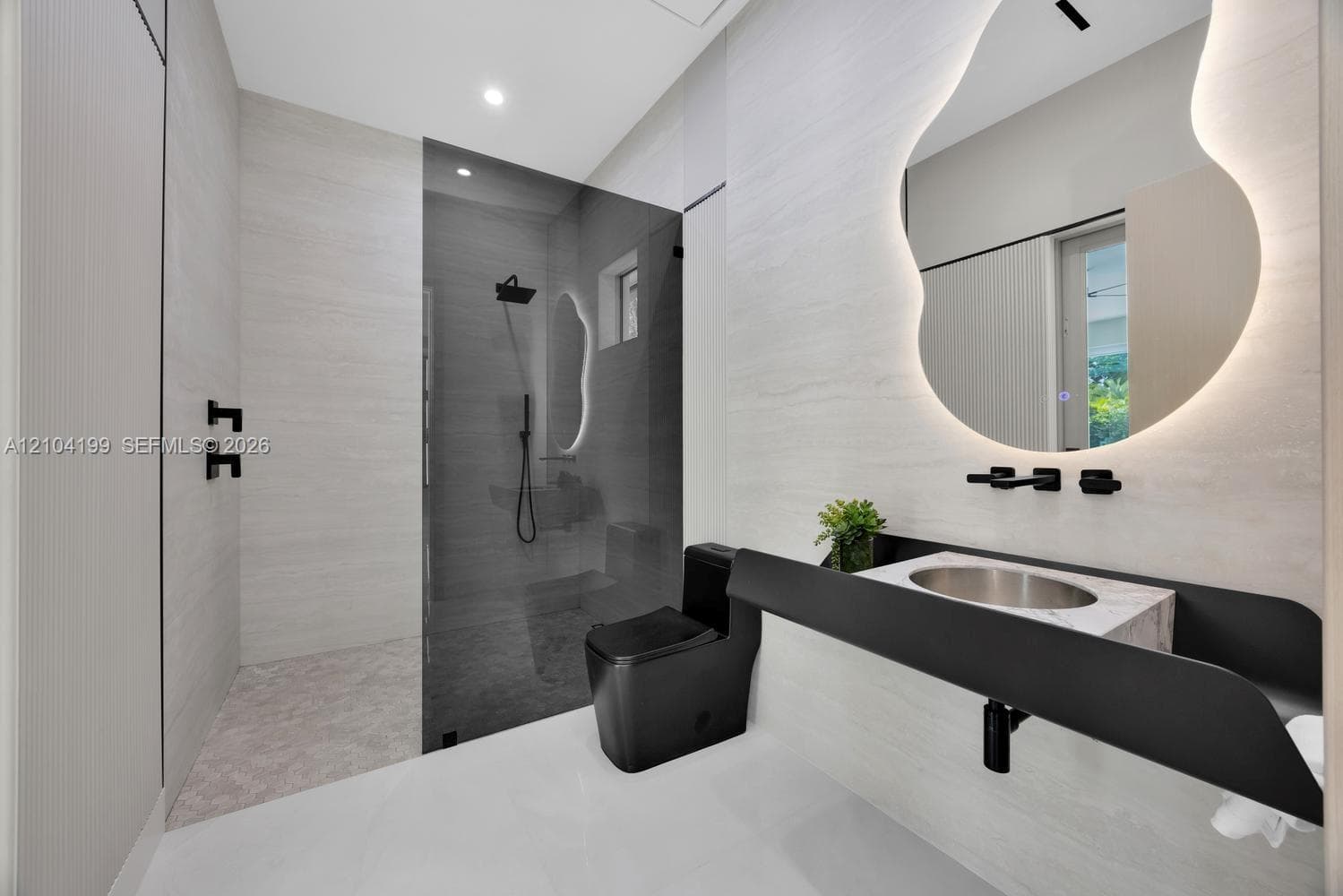 Tray ceiling featuring recessed LED accent lighting, floor-to-ceiling sliding glass doors, polished flooring, a black multi-blade ceiling fan, and recessed can lighting