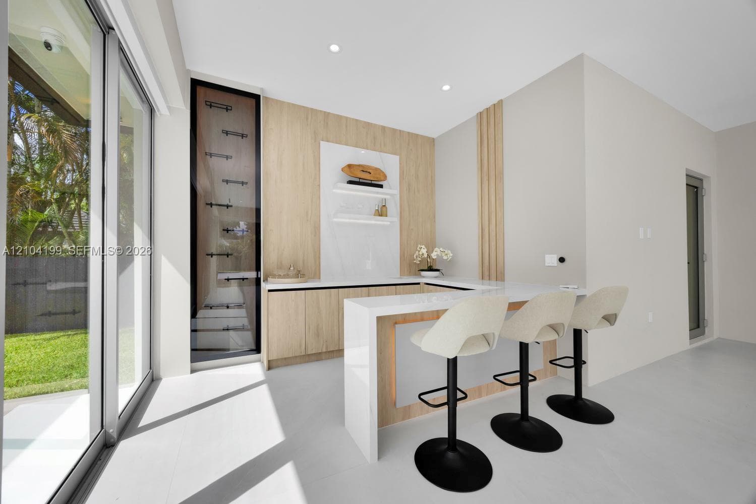 Tray ceiling featuring integrated LED lighting, polished tile flooring, recessed lighting, ceiling fan, and floor-to-ceiling sliding glass doors
