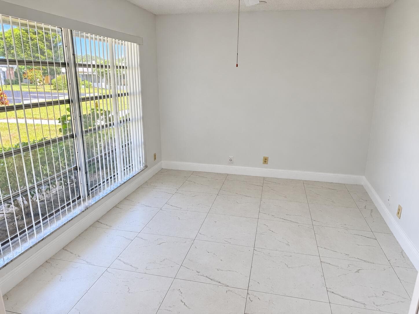Bright Empty Room with Windowed Wall
