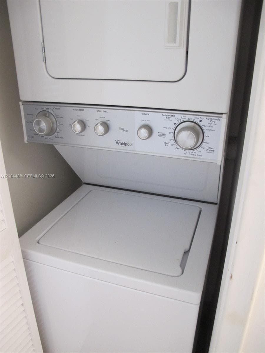 Stacked white washer and dryer unit