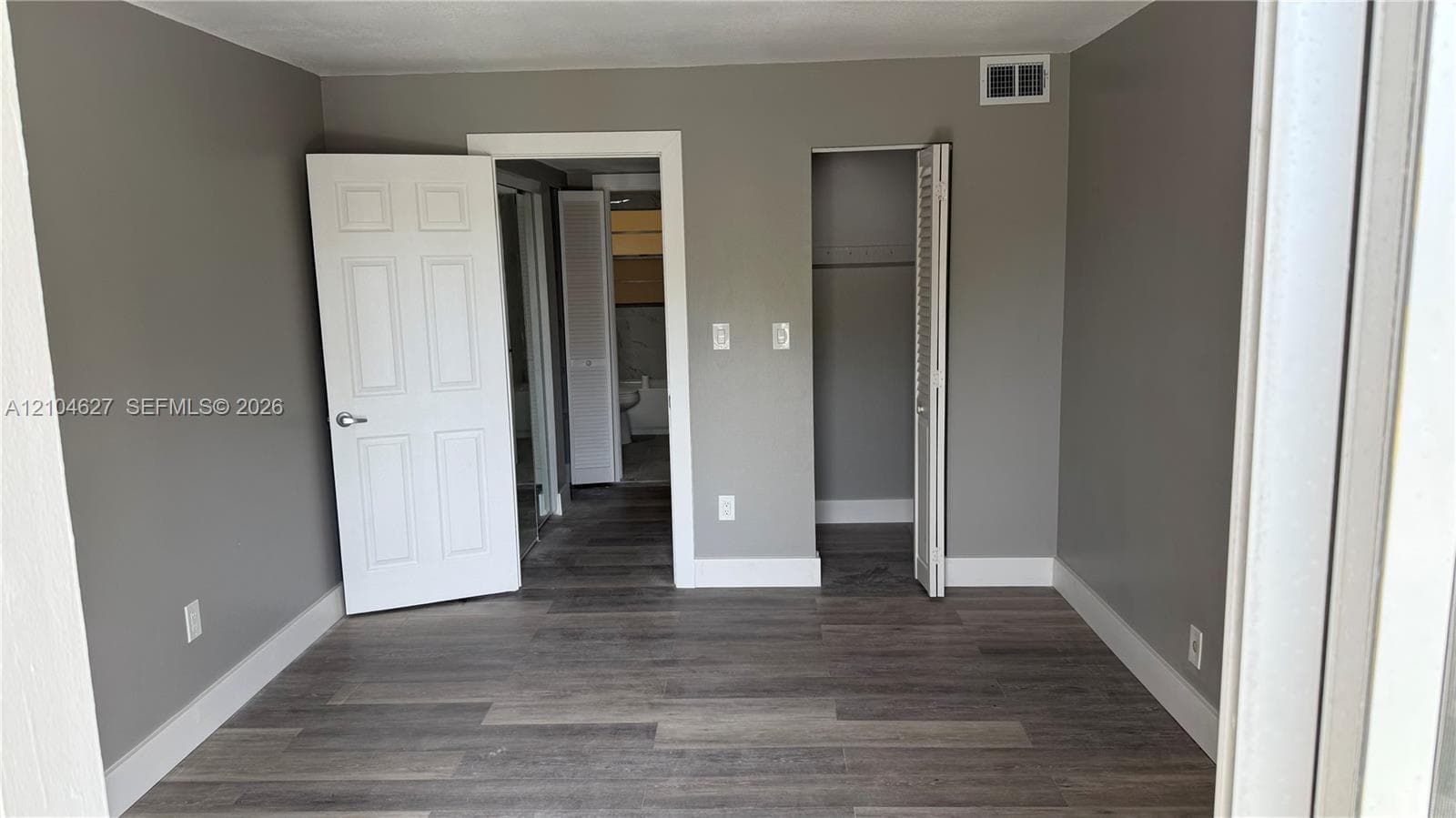 Bedroom with walk in closet