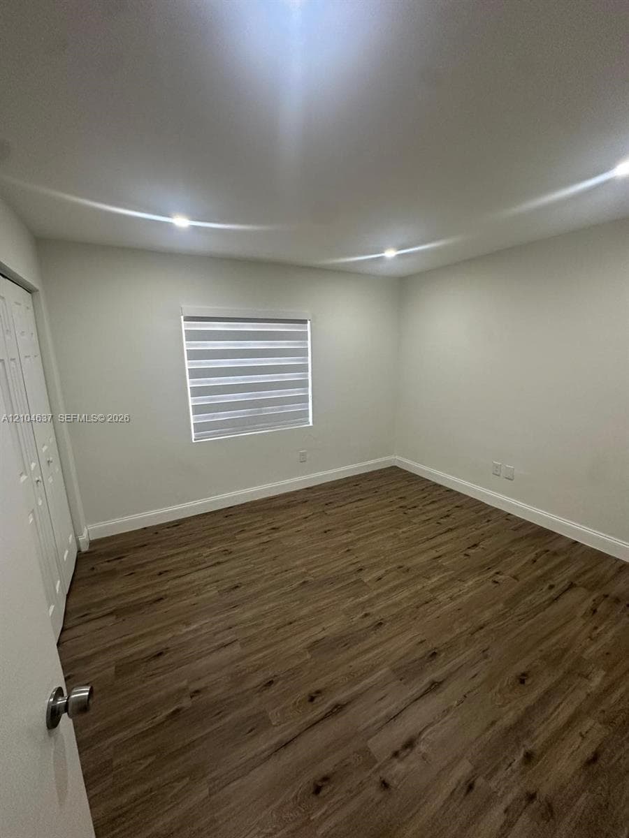 Recessed lighting, wood-finish flooring, and window treatments