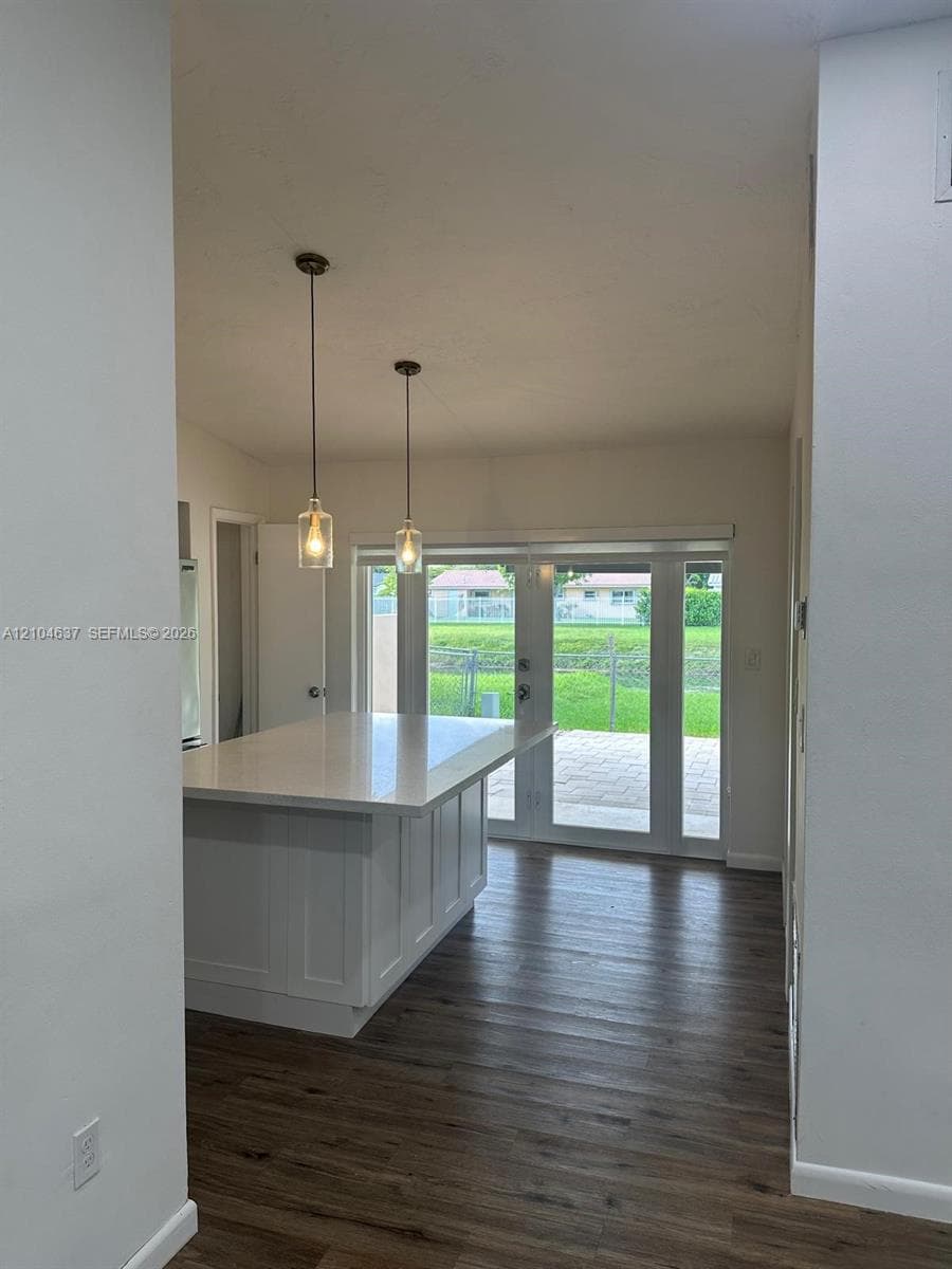 Central kitchen island with a white countertop