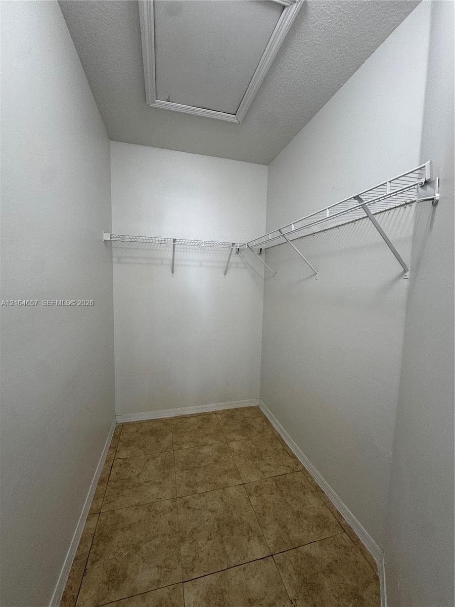 Primary bedroom walking closet
