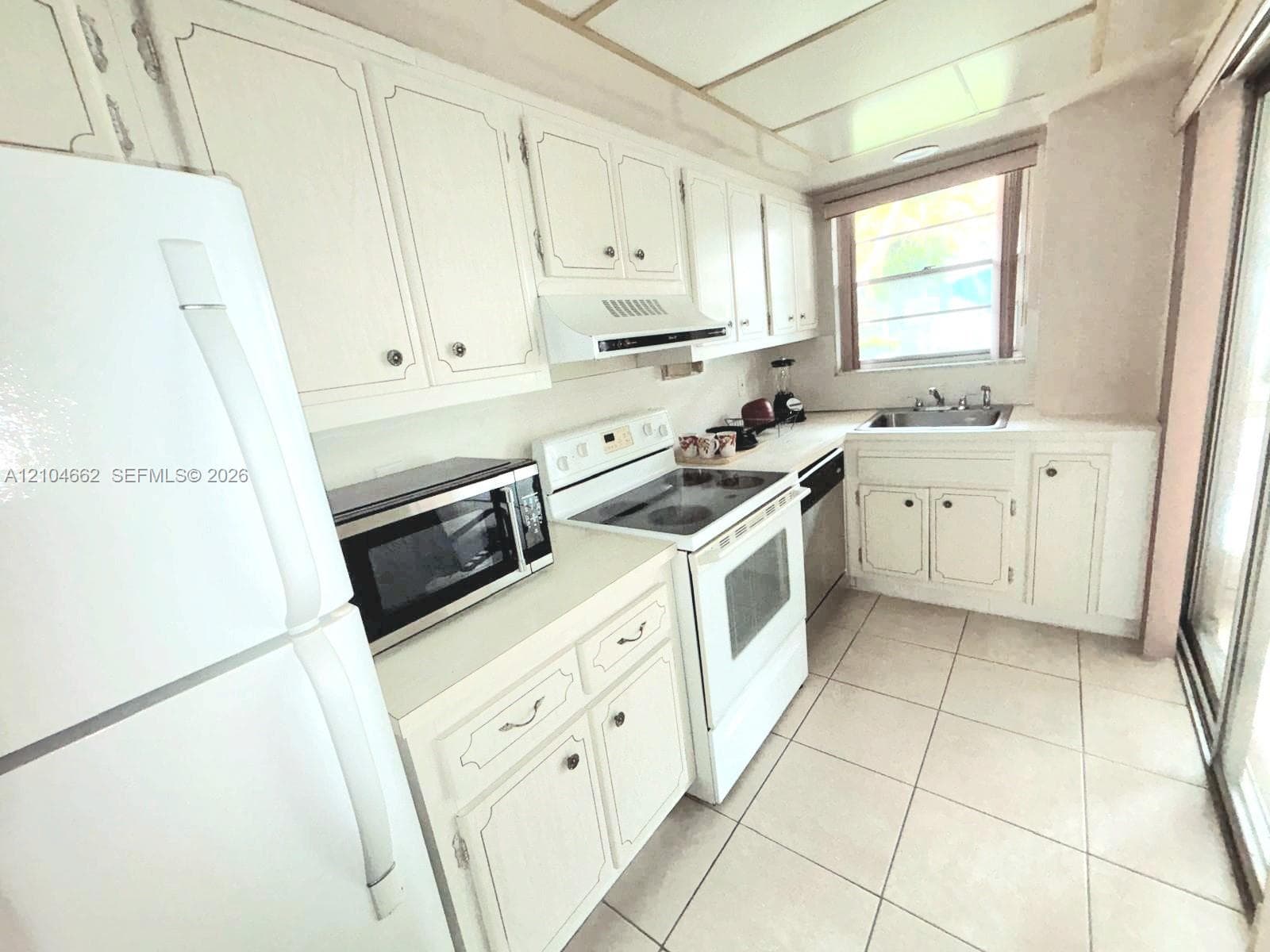 White cabinetry with decorative trim