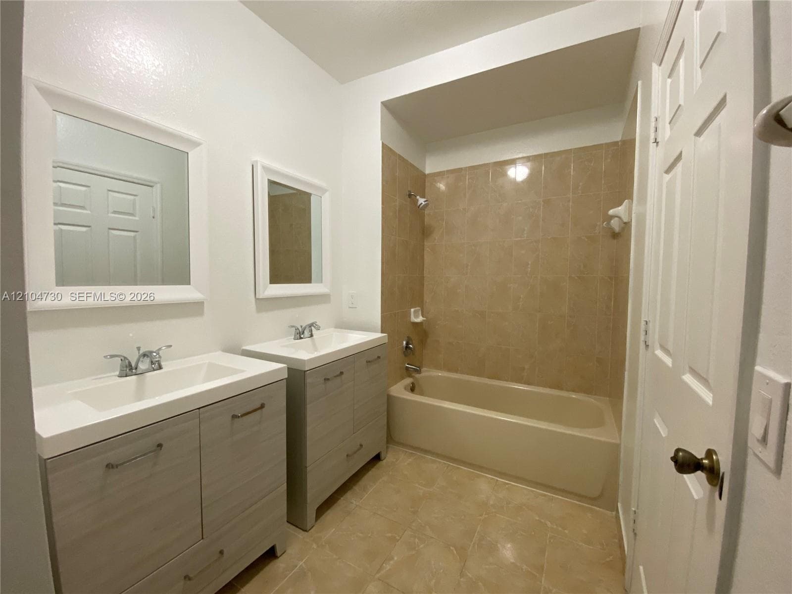Large master bathroom with two sink cabinets.