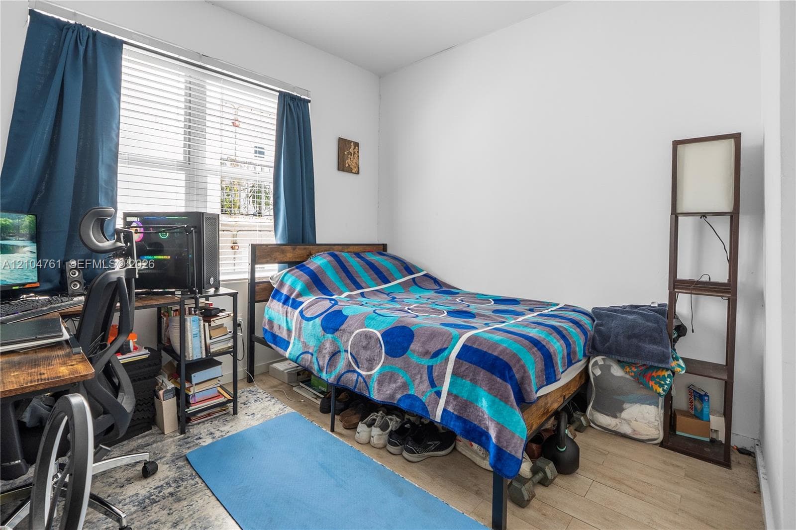 The second bedroom maintains the natural light theme with plenty of space