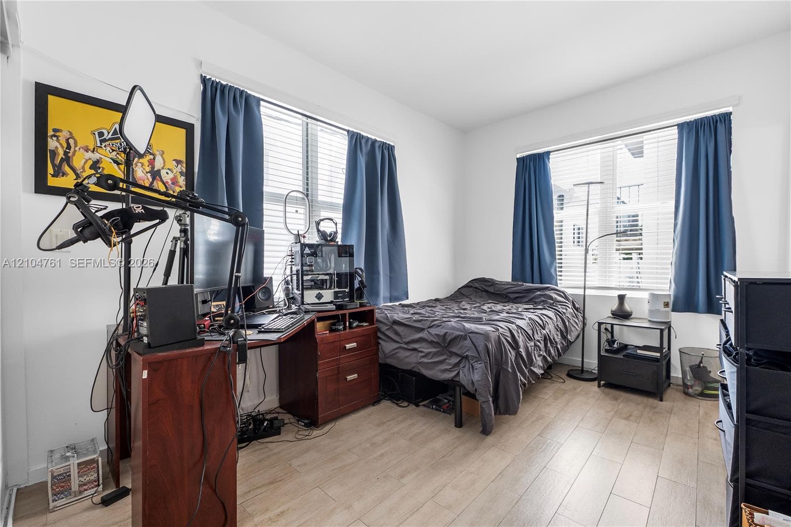 The large main bedroom, also filled with natural light, has an ensuite bathroom