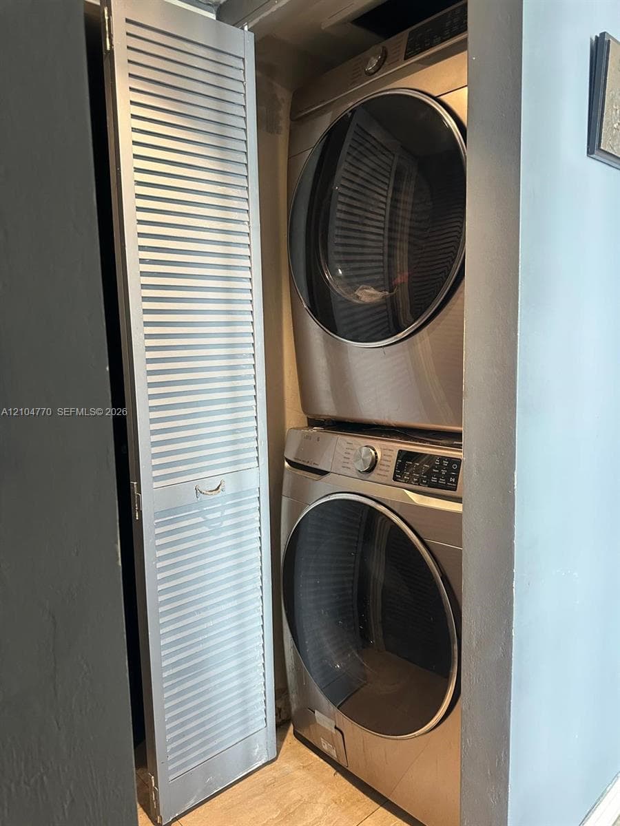 Stacked washer and dryer unit