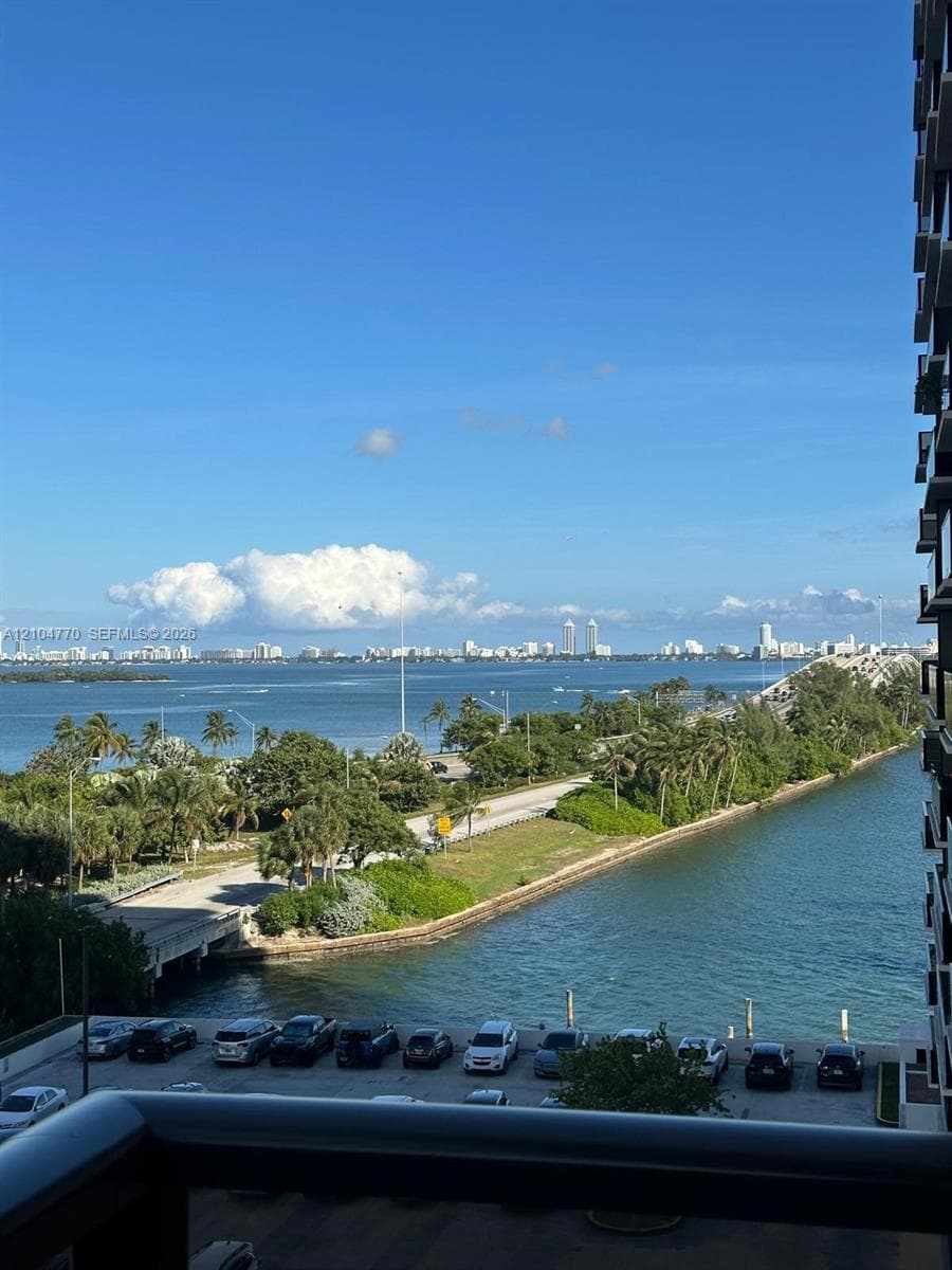 Expansive waterfront scenery with surrounding urban landscape