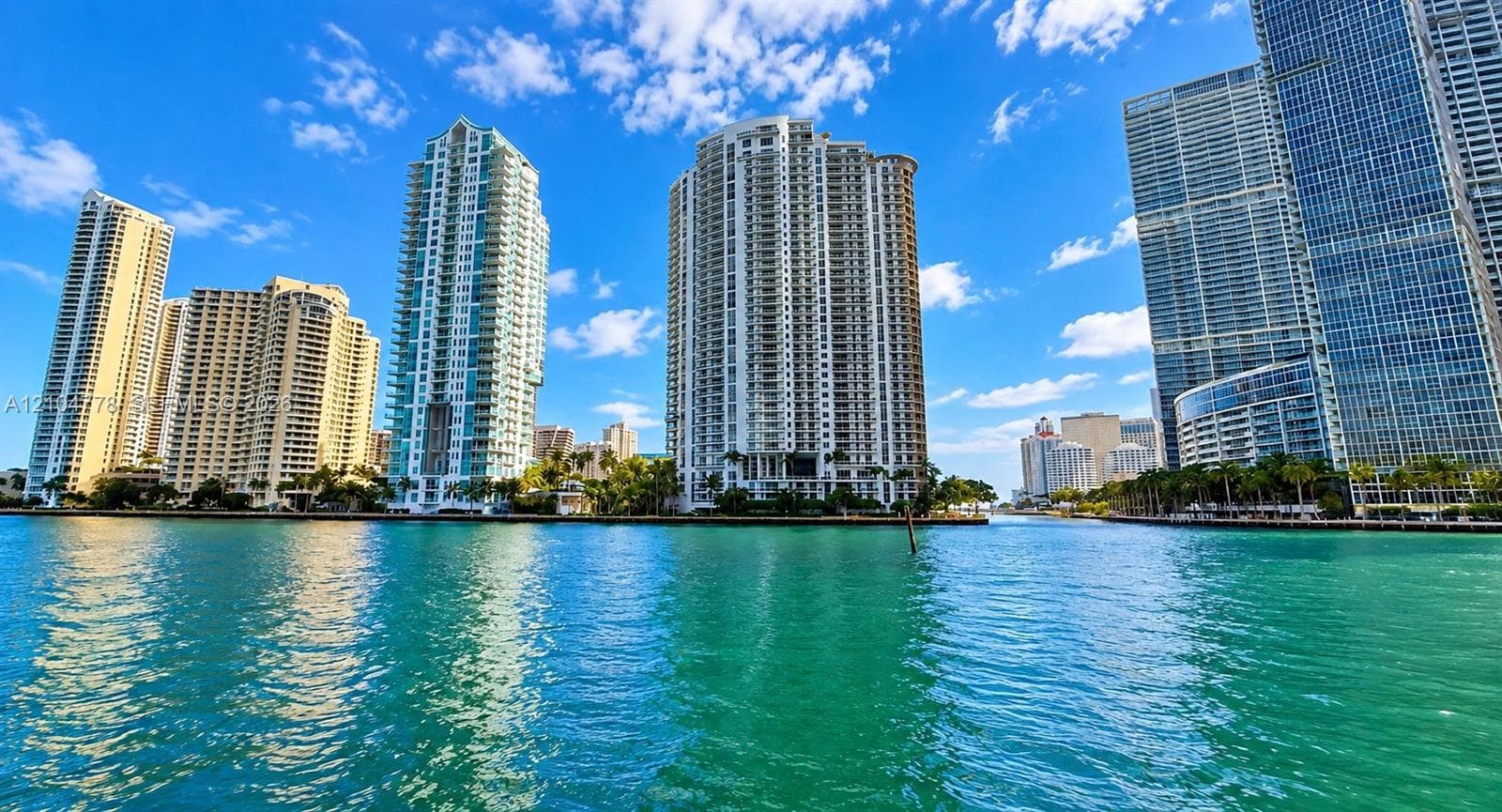 Waterfront urban setting with multiple high-rise buildings and contemporary architectural designs